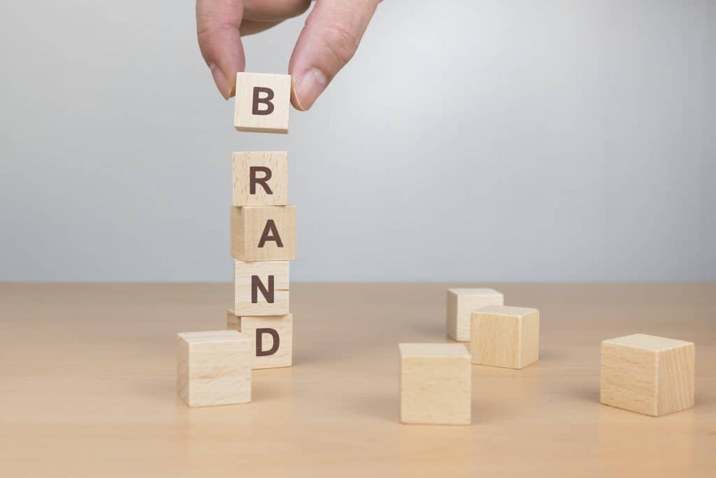 brand word written wood block